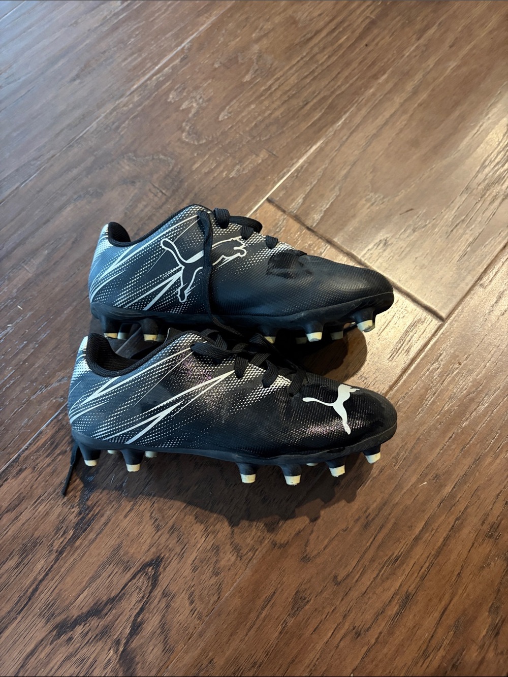Puma Kids Black Soccer Cleats with White Accents